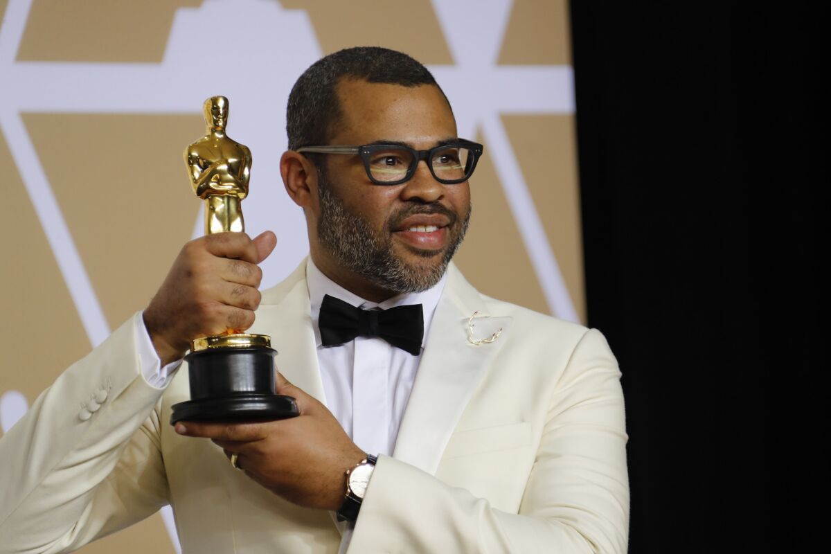 Jordan Peele, backstage with his Oscar for original screenplay for "Get Out."