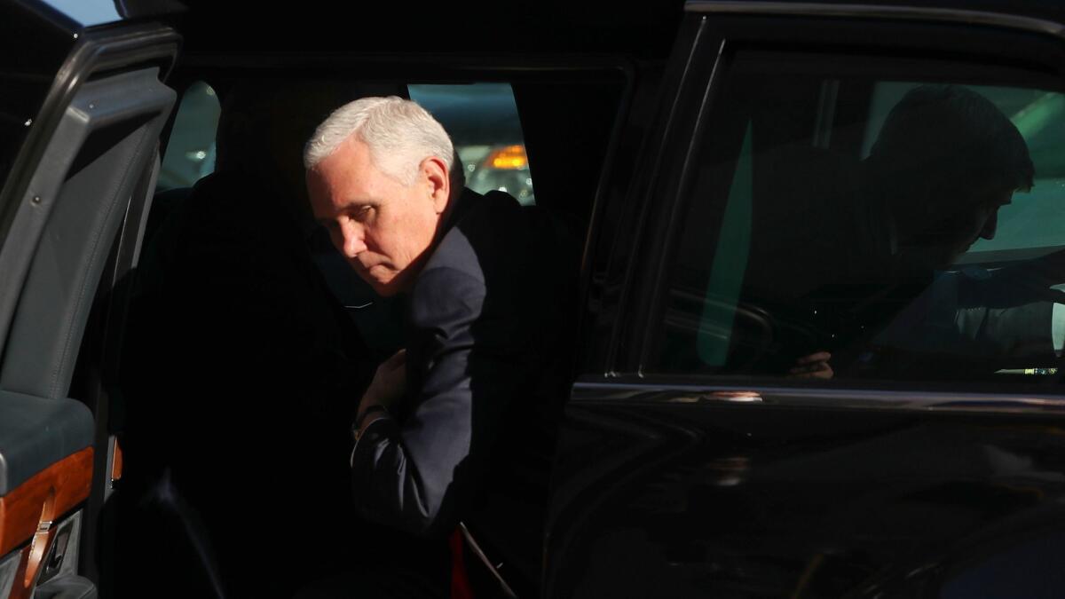 Vice President Mike Pence steps out of a motorcade vehicle after he and President Trump arrived at the Pentagon on Thursday.
