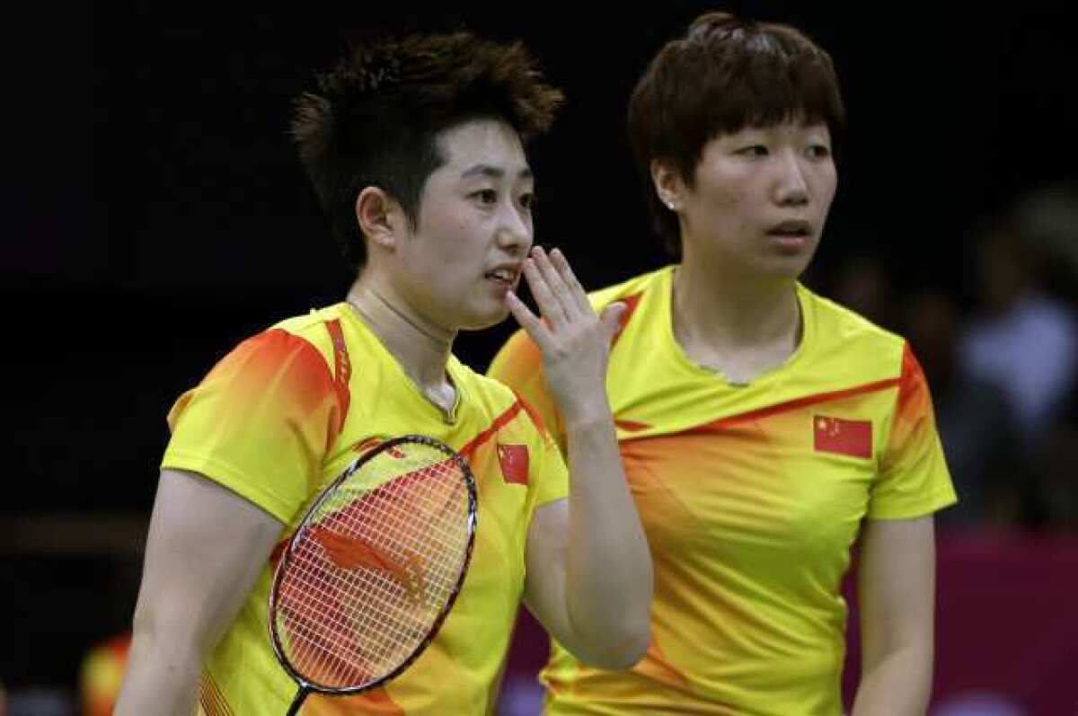 China's Yu Yang, left, and Wang Xiaoli in a women's doubles badminton match.