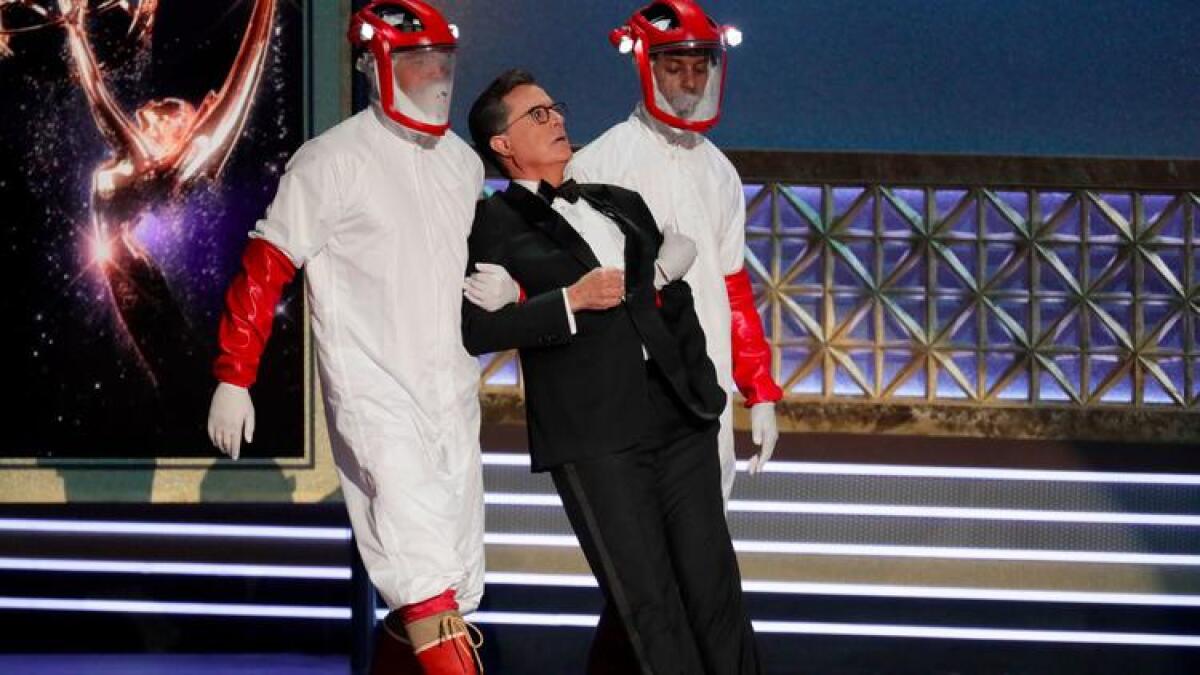 Emmys host Stephen Colbert being carried in a bit inspired by HBO's "Westworld."