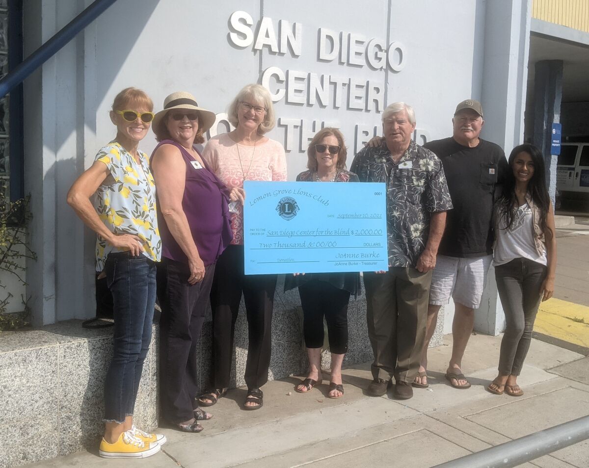Members of the Lemon Grove Lions Club presented a $2,000 check to the San Diego Center for the Blind.