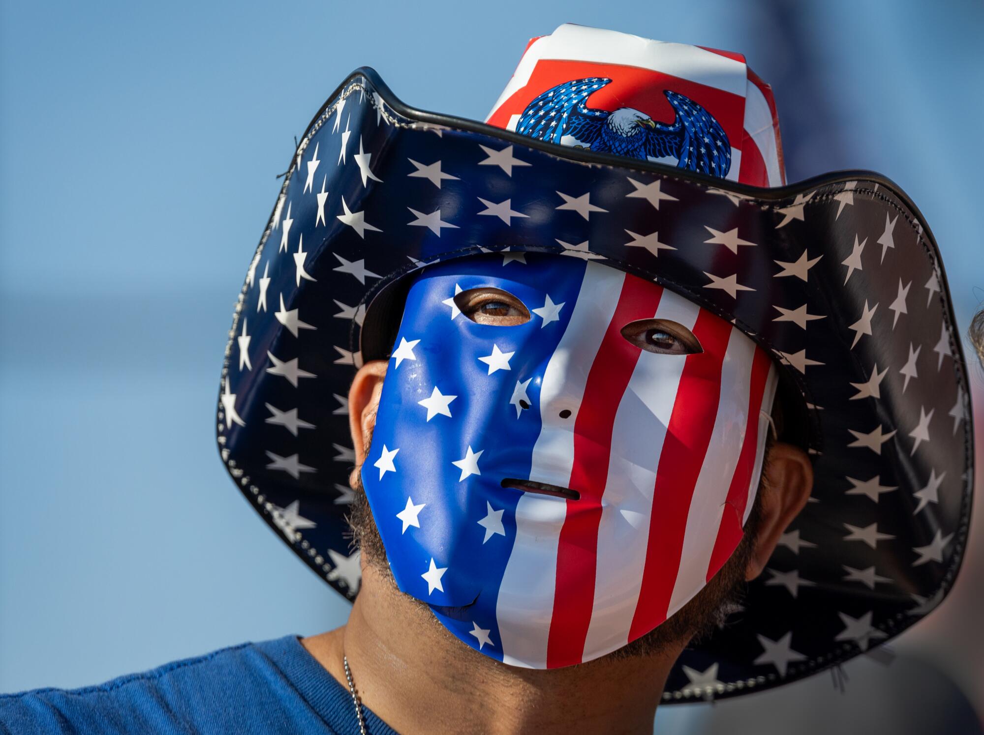 A man in an American flag hat and face paint