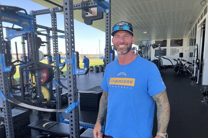Former Chargers All-Pro center Nick Hardwick takes a break in the weight room.