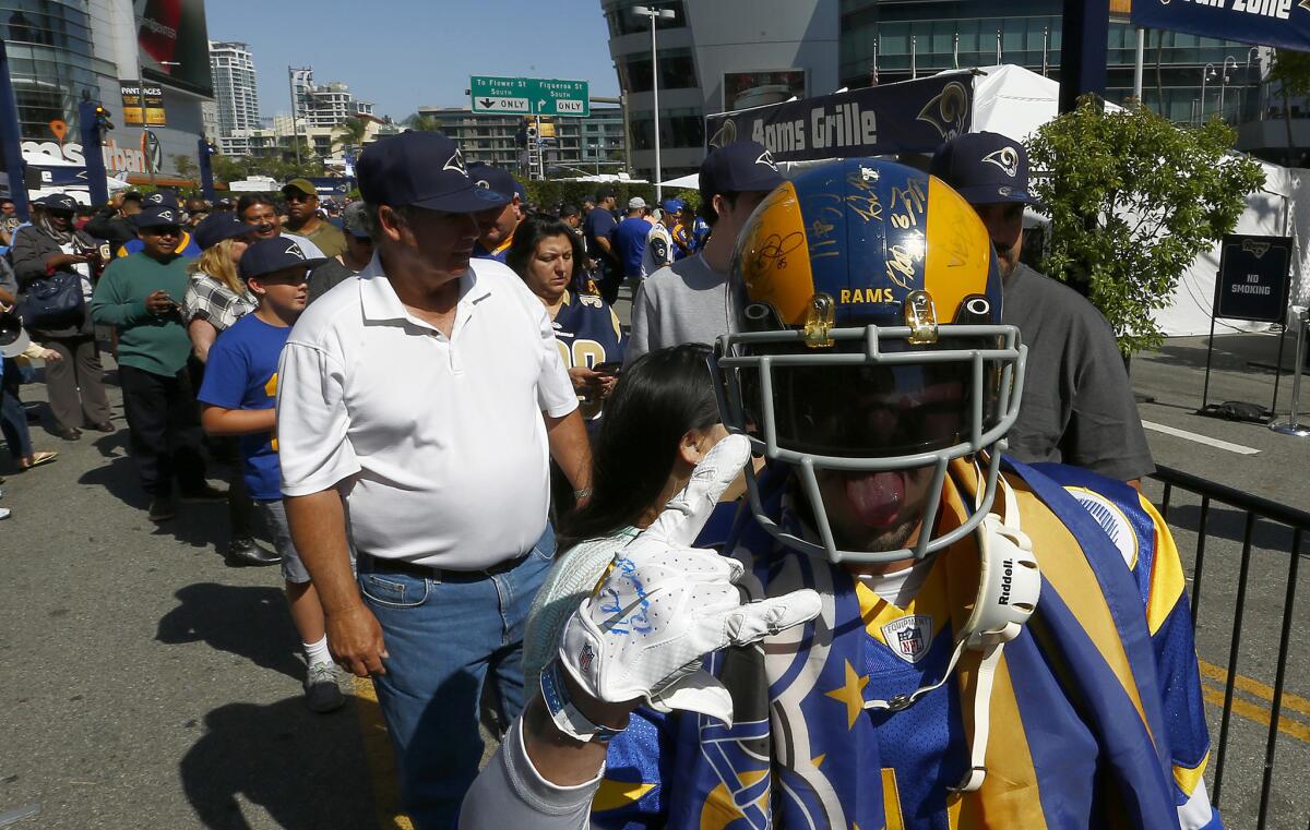 Rams fans wait in line to enter an NFL draft event at L.A. Live on April 28.