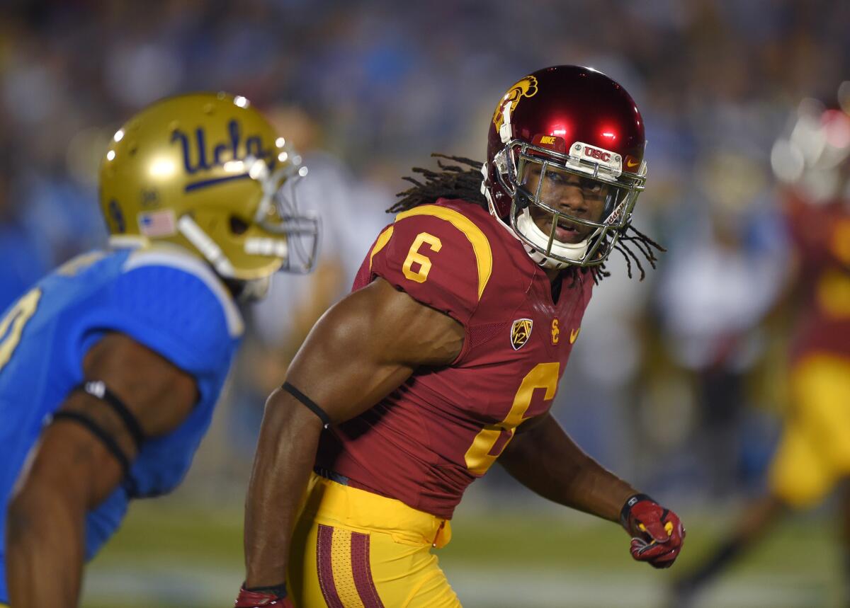 USC cornerback Josh Shaw guards UCLA receiver Jordan Payton during a game at the Rose Bowl on Nov. 22, 2014.