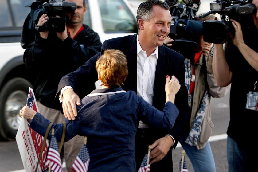 Candidate David Jolly greets supporters as he arrives at the Indian Shores Town Hall to place his vote in the special election for Florida 13th Congressional District.