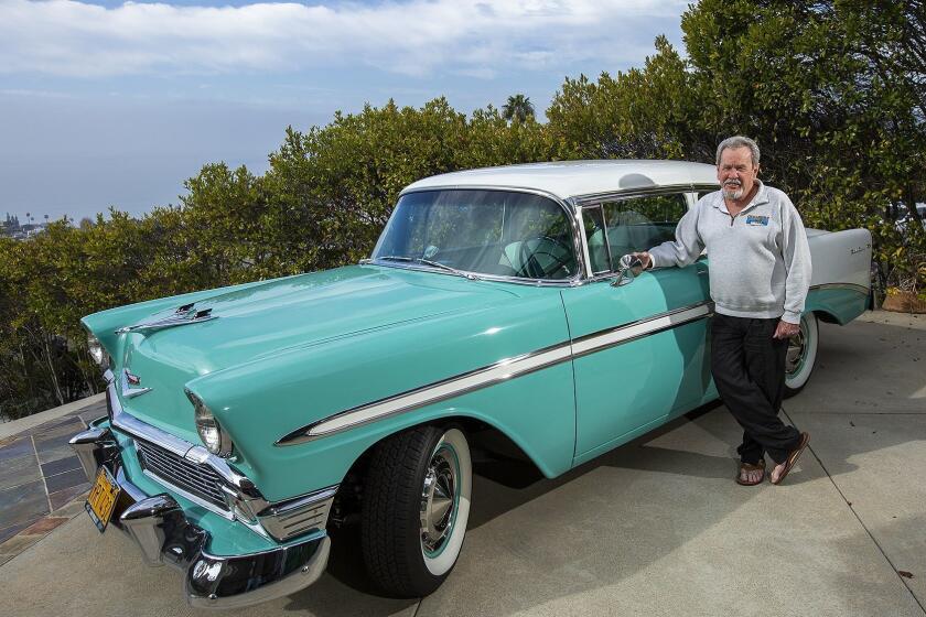 Kelly Boyd, the former mayor of Laguna Beach, poses for a portrait with his 1956 Chevy Bel Air outside his home on Friday, January 11.