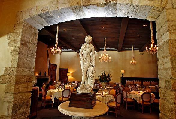 A lithe stone statue of a woman greets diners at Pinot Provence, a long running French restaurant in Costa Mesa that today features a new chef and menu.