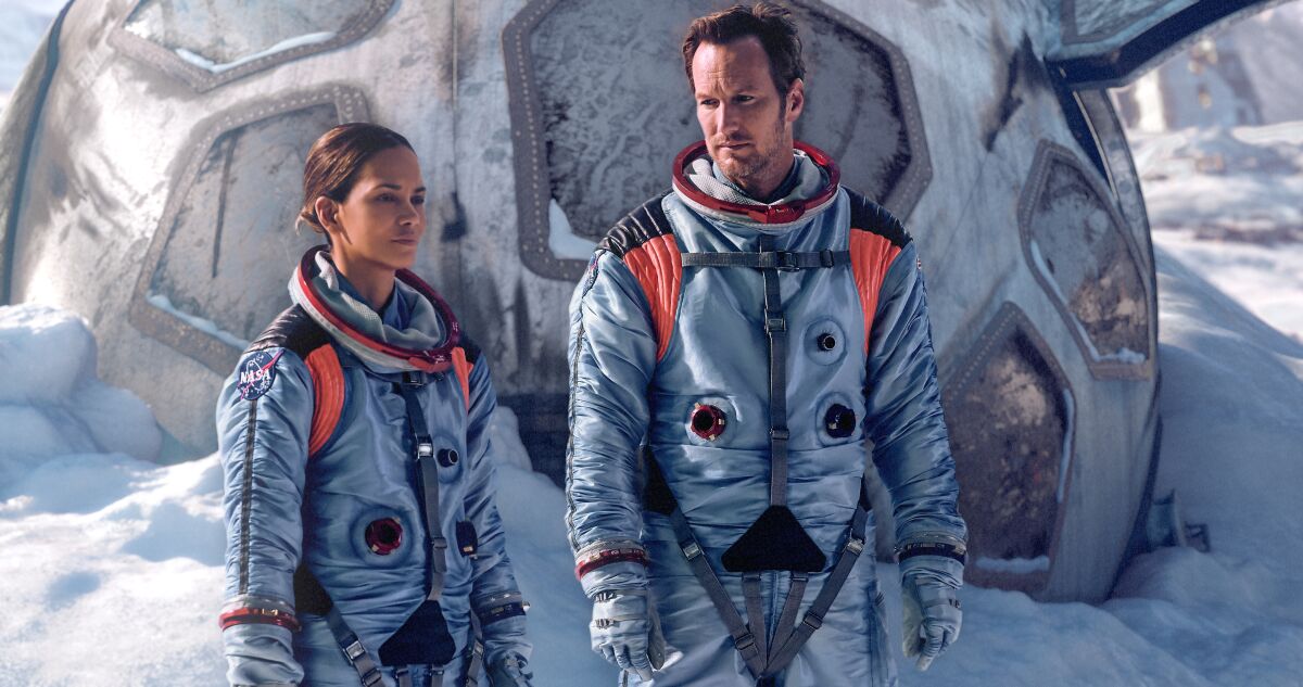 Halle Berry and Patrick Wilson in space suits in a scene in "Moonfall."