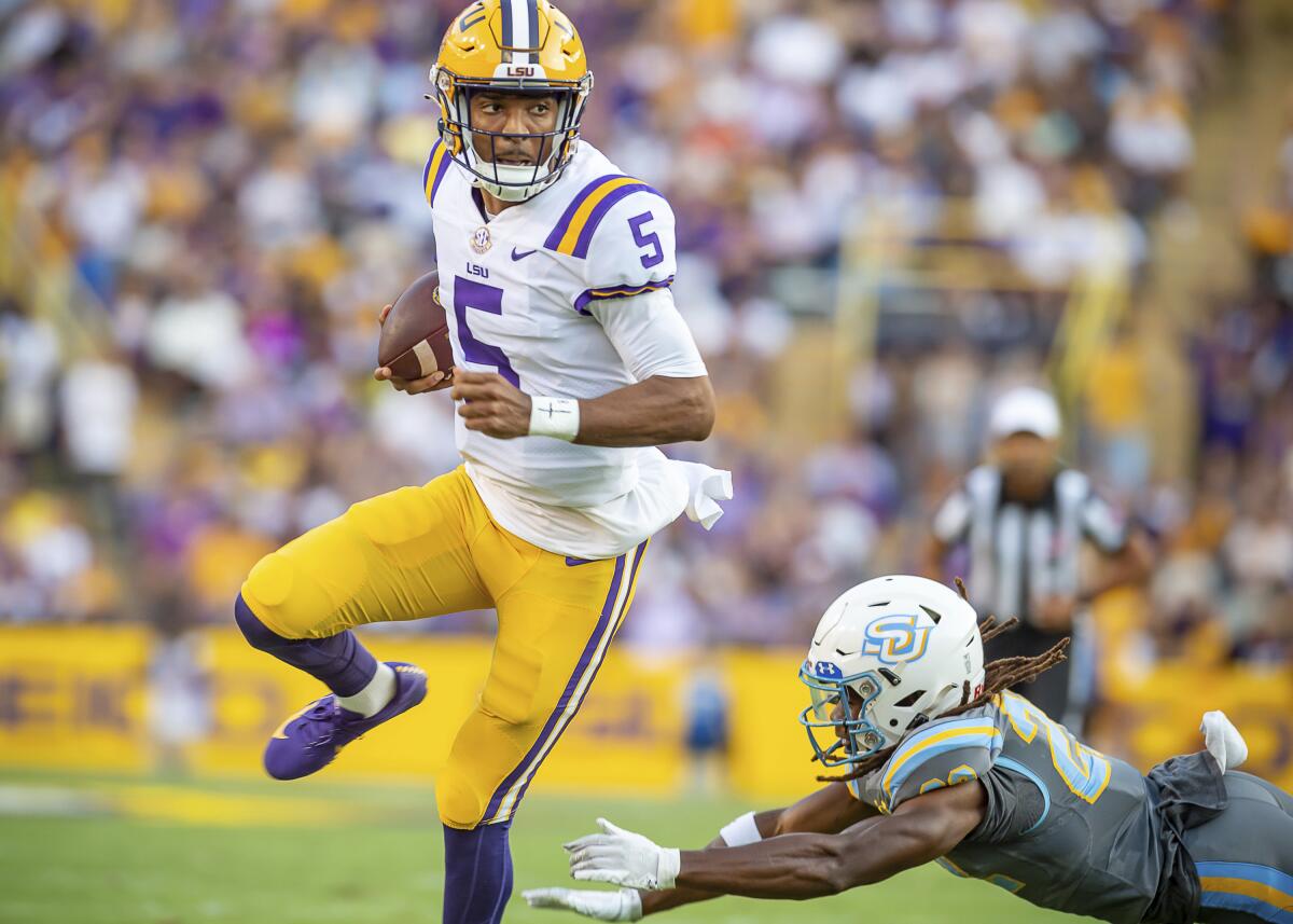 LSU quarterback Jayden Daniels runs for a touchdown against Southern University during an NCAA college football game Saturday, Sept. 10, 2022, in Baton Rouge, La. (Scott Clause/The Daily Advertiser via AP)