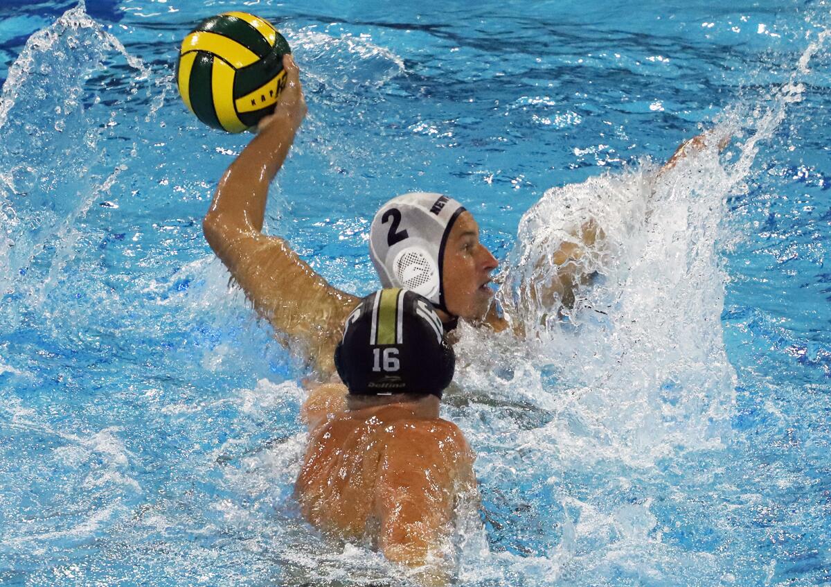 Newport Harbor's Gavin Appeldorn (2) looks for an opening against JSerra during Saturday's match.
