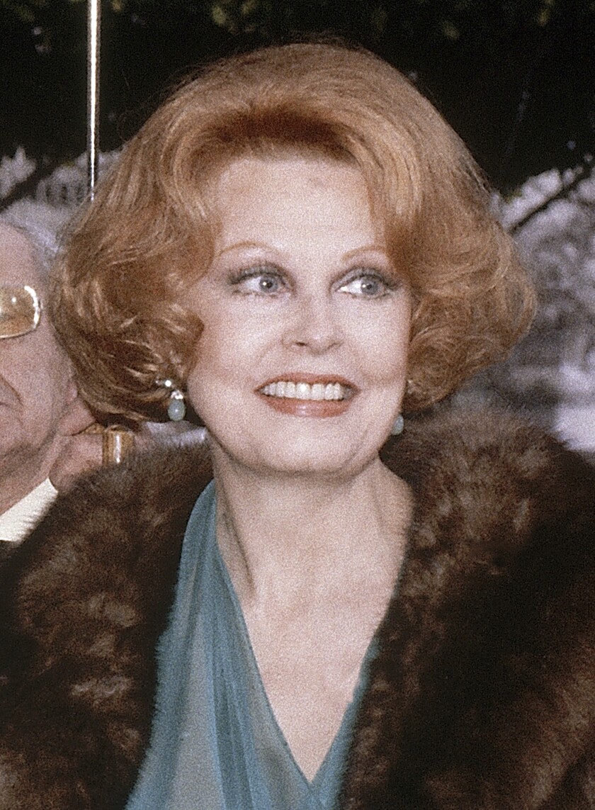 FILE - Actress Arlene Dahl arrives at the 54th Annual Academy Awards in Los Angeles, March 29, 1982. Dahl, the actor whose charm and striking red hair shone in such Technicolor movies of the 1950s as “Journey to the Center of the Earth" and “Three Little Words,” died Monday, Nov. 29, 2021, at age 96. (AP Photo/Reed Saxon, File)