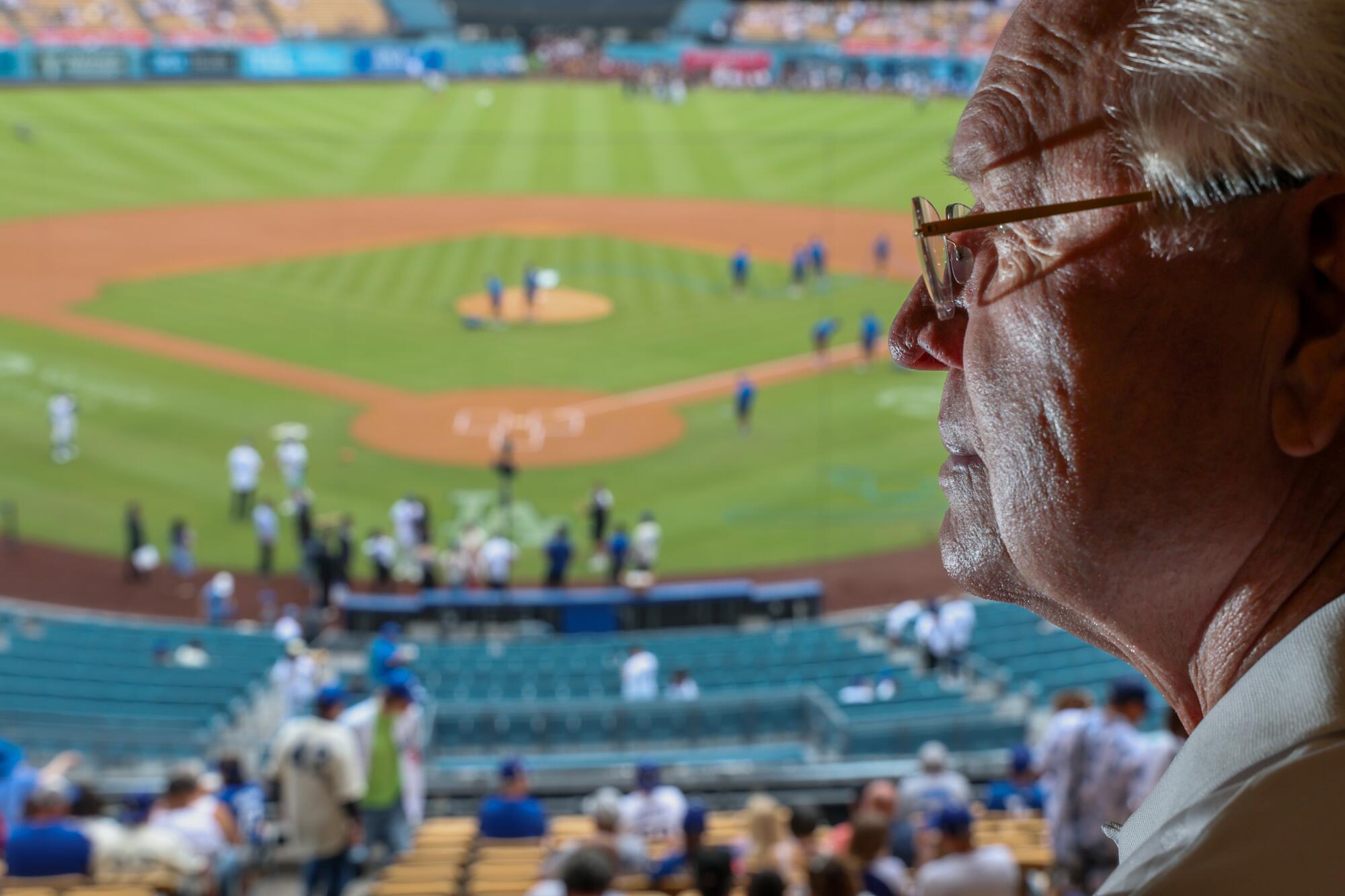 How Invoice Russell stayed related to baseball, and reconnected with the Dodgers 1 Bill Russell at his loge section perch where he observes umpires during games at Dodger Stadium.