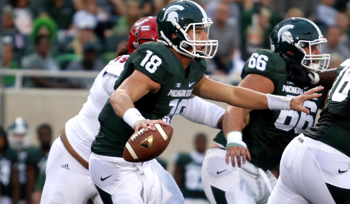 Michigan State quarterback Connor Cook scrambles against Jacksonville State in the first quarter Friday night.