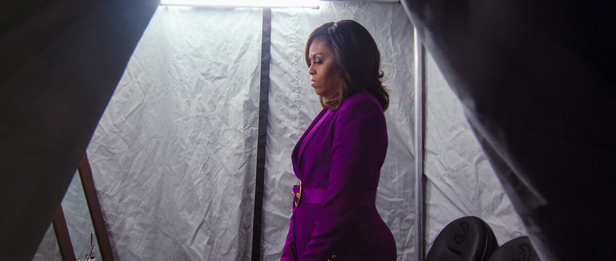 Michelle Obama waits backstage on her book tour in a scene from "Becoming."
