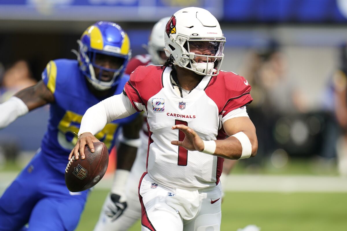 Cardinals quarterback Kyler Murray rolls out during an NFC West game against the Rams in October.