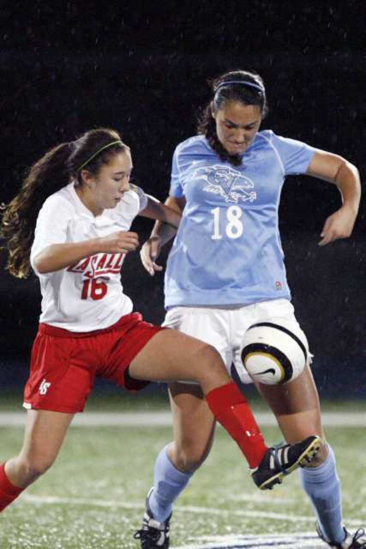 Crescenta Valley senior Katie Callister, right, scored a rebound goal in the first minute of extra time to secure the win for the Falcons.