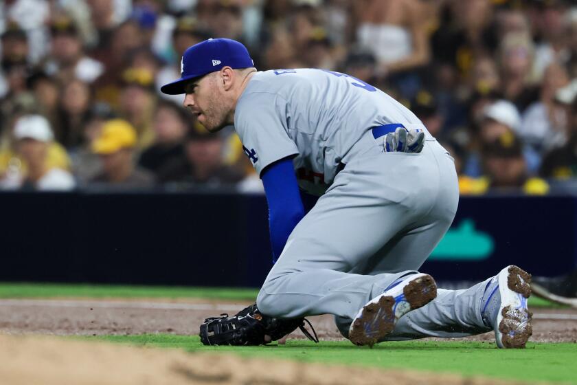 SAN DIEGO, CALIFORNIA - OCTOBER 08: Freddie Freeman #5 of the Los Angeles Dodgers is unable to handle a ball for an error during the second inning in game three of the National League Division Series against the San Diego Padres at Petco Park on Tuesday, Oct. 8, 2024 in San Diego. (Robert Gauthier / Los Angeles Times)