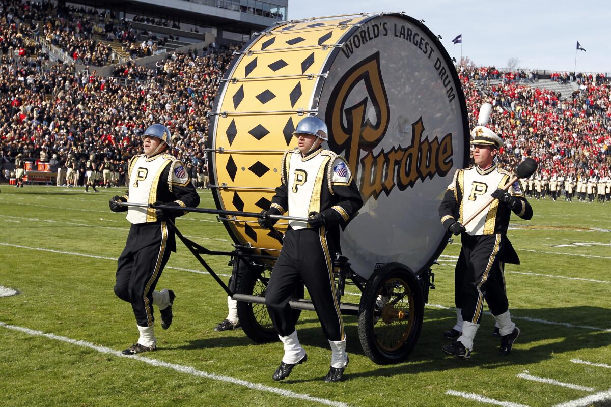 Members of the Purdue Marching Band and the "World's Largest Drum" perform at the Ohio State/Purdue football game.