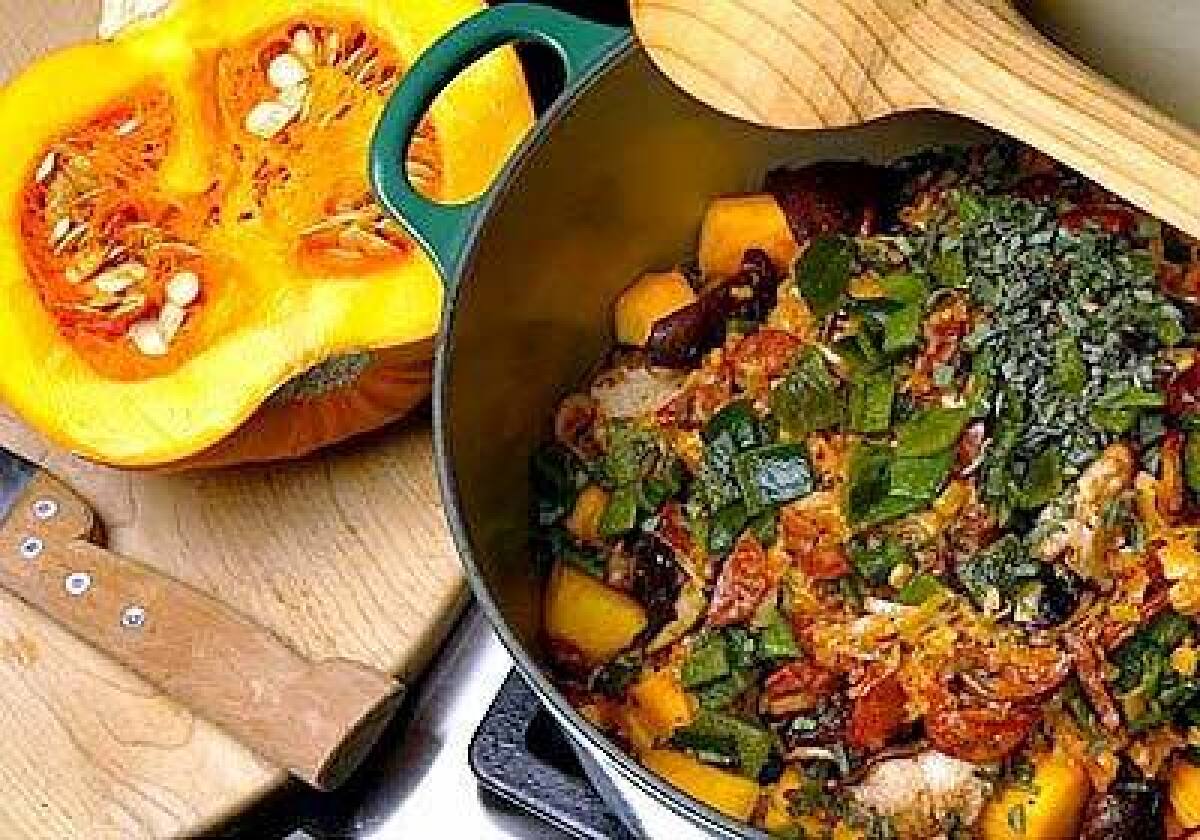 Pumpkin ragout with chorizo and shiitake mushrooms is cooked in a Dutch oven after the vegetables and chorizo have been sauteed. Beef or vegetable stock, leeks and garlic are then added to the pot where the flavors simmer.