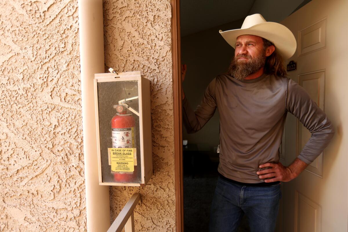 Greg Gibson, a neighbor of the ULNV gunman, in his doorway