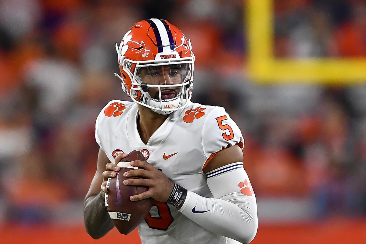 FILE - Clemson quarterback DJ Uiagalelei looks to pass during the first half of an NCAA college football game against Syracuse in Syracuse, N.Y., Friday, Oct. 15, 2021. Uiagalelei is among nine returning offensive starters for Clemson. (AP Photo/Adrian Kraus, File)