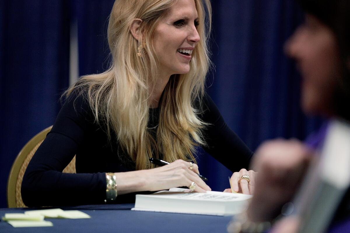 Conservative pundit and author Ann Coulter signs books at the Conservative Political Action Conference, where she participated in a debate on immigration.