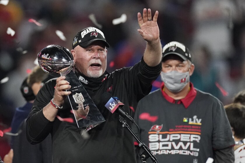 Buccaneers coach Bruce Arians holds up the Vince Lombardi trophy after defeating the Kansas City Chiefs.