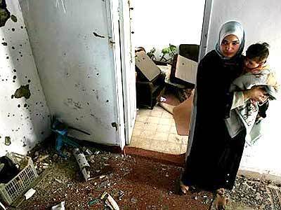 Bullets riddle the walls of Bilal Mahmoud abu Abed's home in the West Bank town of Jenin, where fighting with Palestinians was particularly fierce. Israeli soldiers also ransacked the house.