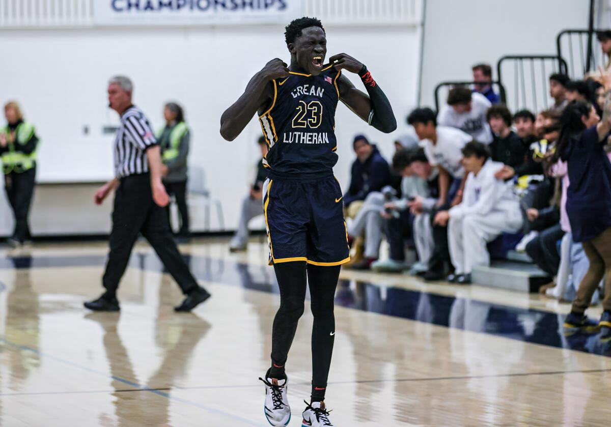Jacob Majok of Crean Lutheran lets loose a scream while pulling up the top of his jersey.
