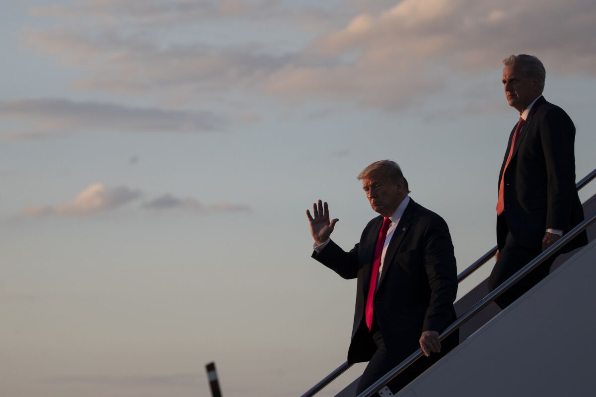 President Trump, left, steps off Air Force One with House Minority Leader Kevin McCarthy in May.