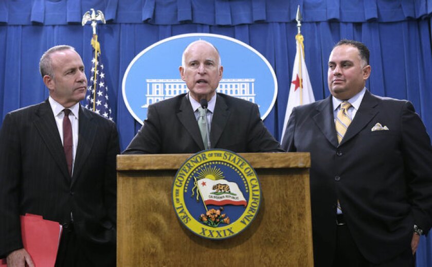 Gov. Jerry Brown reports on the budget compromise with Senate President Pro Tem Darrell Steinberg, left, and Assembly Speaker John Perez.