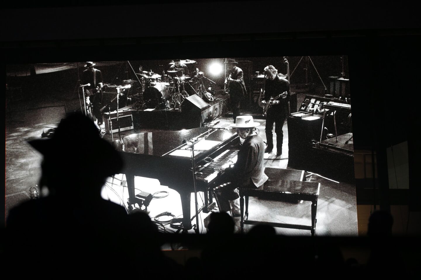 Bob Dylan (at the piano) did not want press photos taken during his set, but promoter Goldenvoice allowed photos of the screen.