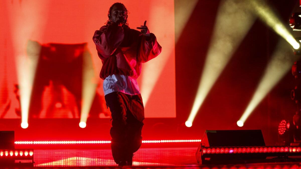 Artist Kendrick Lamar performs at L.A. Live during the NBA All-Stars weekend road show concert on Feb. 16 in downtown Los Angeles.
