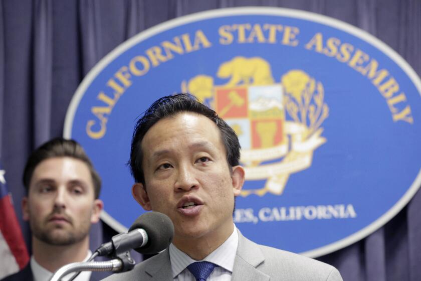 FILE - In this Mar. 17, 2017, file photo, Assemblyman David Chiu, D-San Francisco, Chair of the Assembly Committee on Housing and Community Development, right, speaks in Los Angeles. California Democrats are expanding their efforts to resist President Donald Trump's crackdown on illegal immigration with bills aimed at limiting how much private business people can cooperate with federal immigration authorities. A bill that would bar landlords from disclosing tenants' immigration status passed the Assembly on Monday, May 22, 2017. A measure prohibiting employers from letting immigration agents into their worksites without a warrant cleared a key committee Friday, May 26, 2017. (AP Photo/Nick Ut, File)