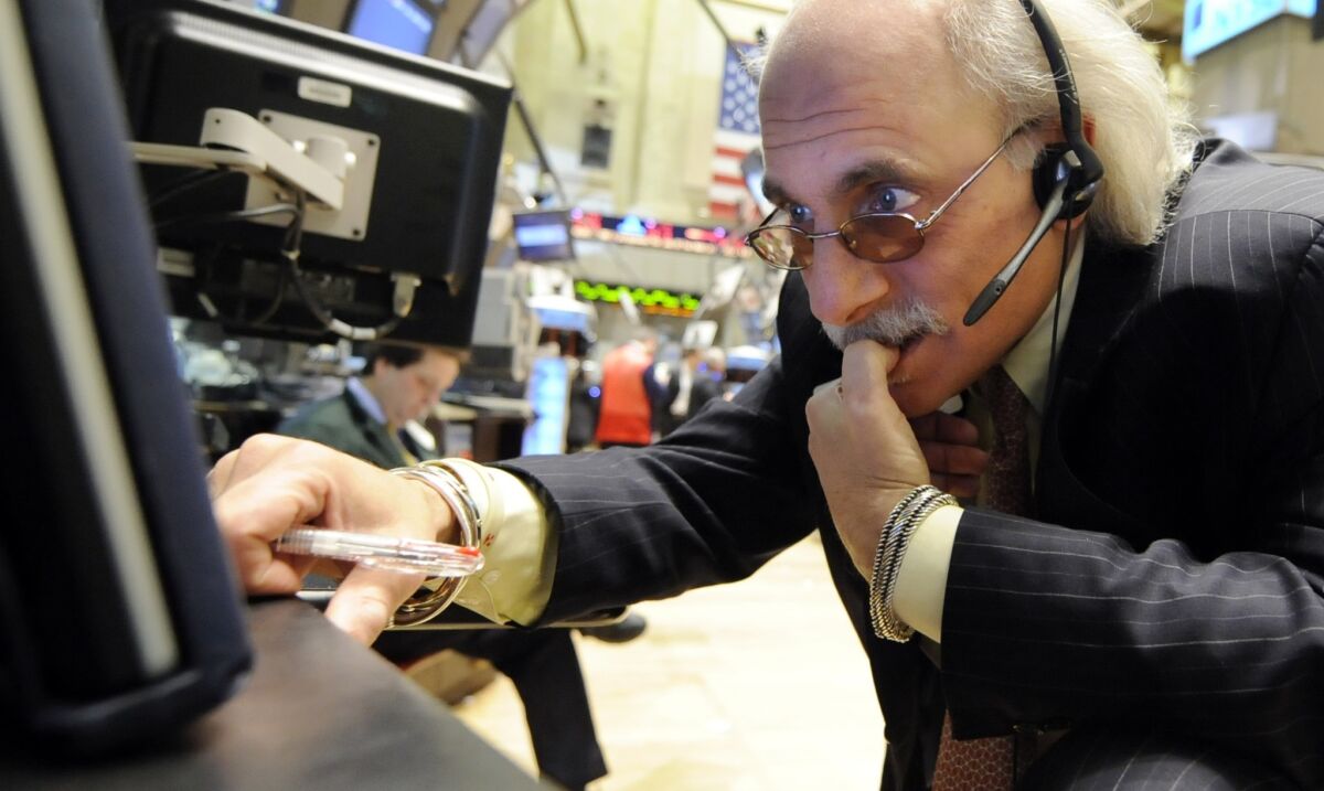 A trader works on the floor of the New York Stock Exchange in 2009, during the Great Recession.