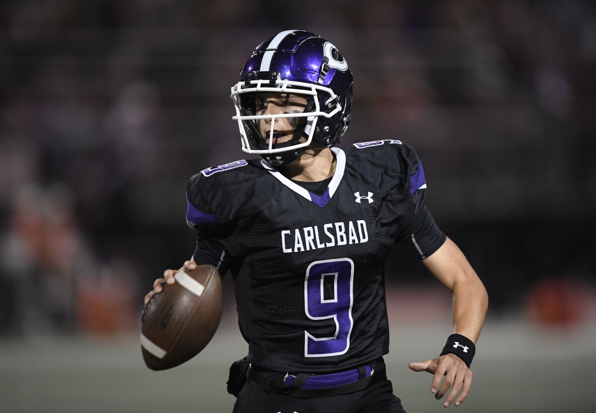 Carlsbad's Julian Sayin looks to pass during the first half of the Landers' win over Torrey Pines on Friday night.
