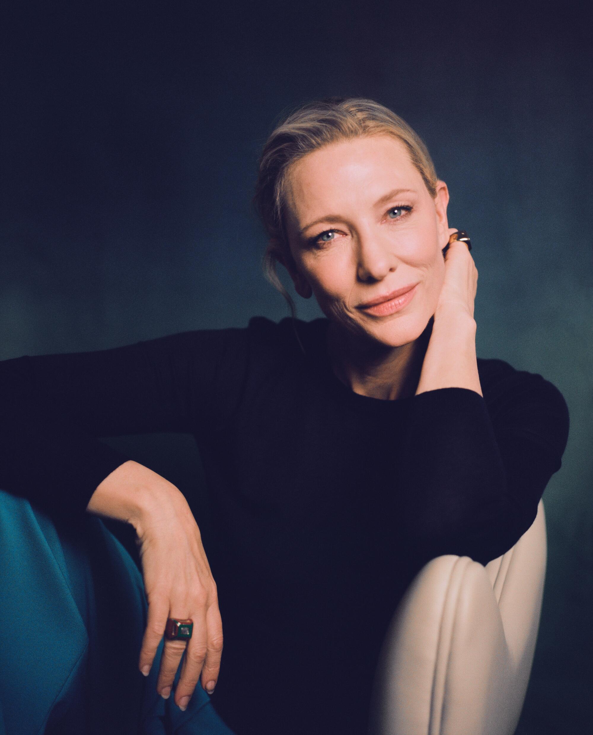 Cate Blanchett relaxes in a chair for portrait.