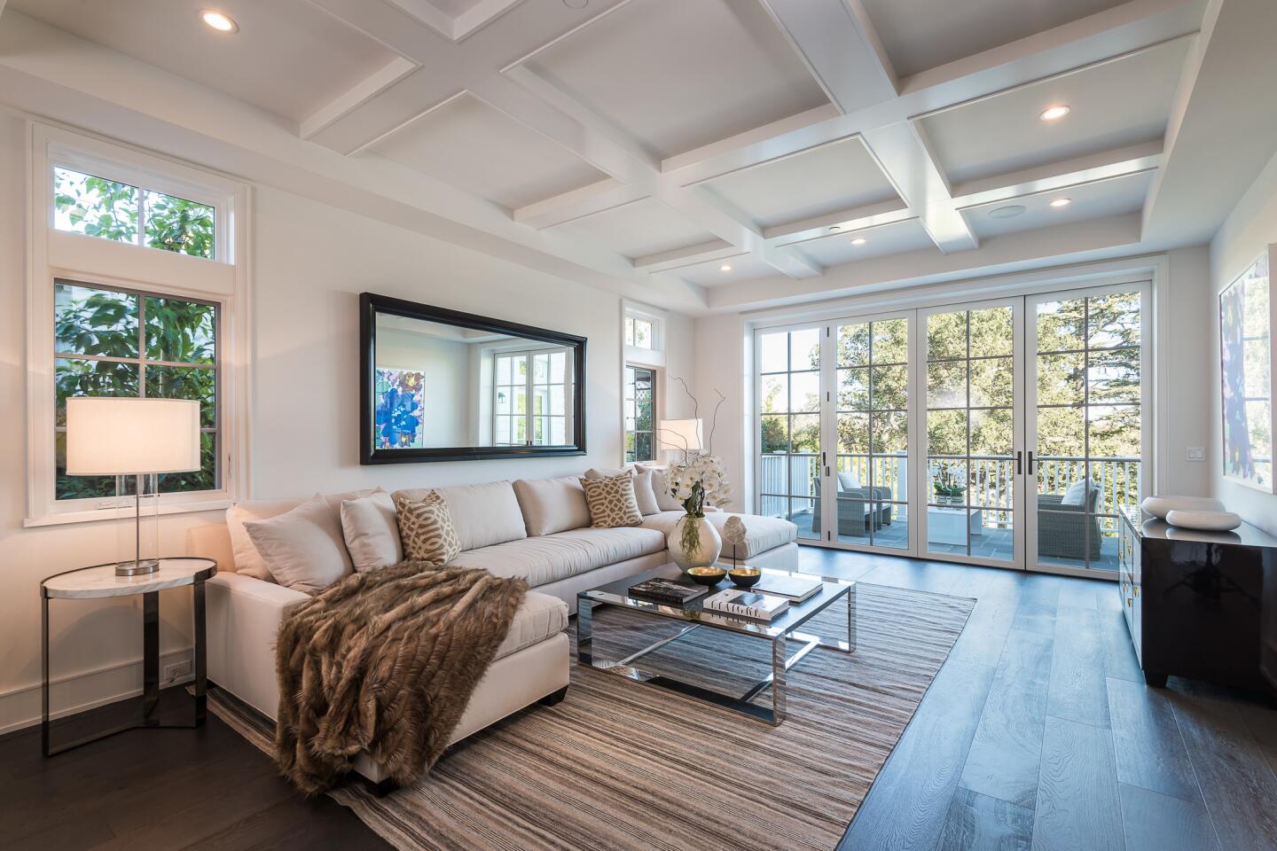 The newly built Traditional-style home has a high-ceiling foyer that takes in canyon views.