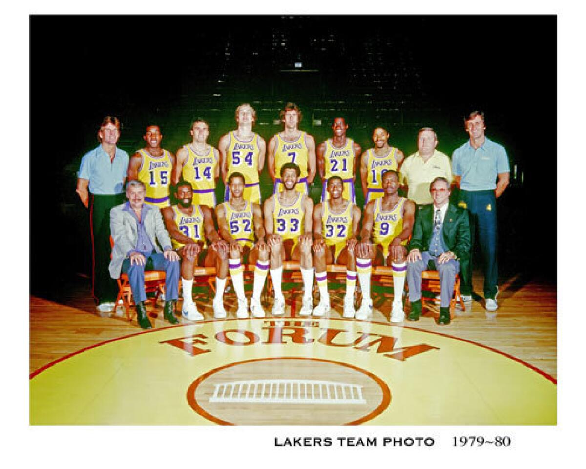 Spencer Haywood, second from left in the bottom row, sits next to owner Dr. Jerry Buss in a team photo of the 1979-80 Lakers.