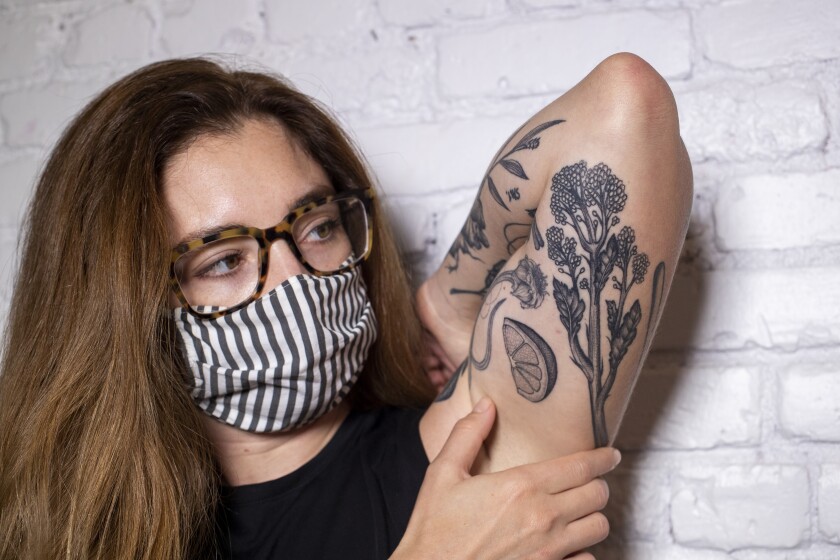 A view of Sydney Kramer's tattoos by tattoo artist Emily Kay.