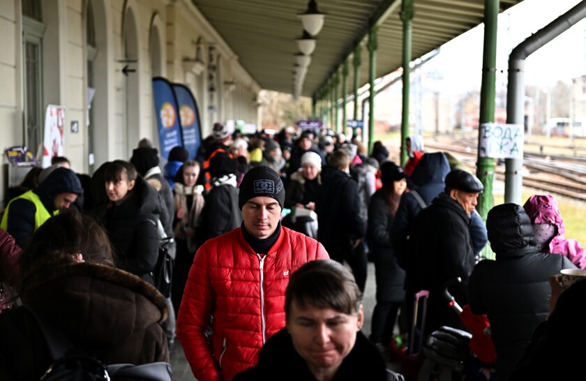 Ukrainian refugees at a Polish train station