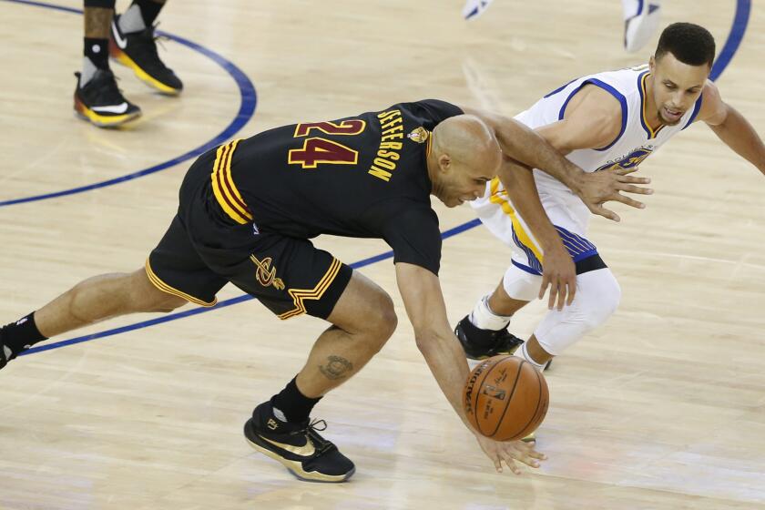 Cavaliers forward Richard Jefferson steals the ball from Warriors guard Stephen Curry in the first half of Game 7.