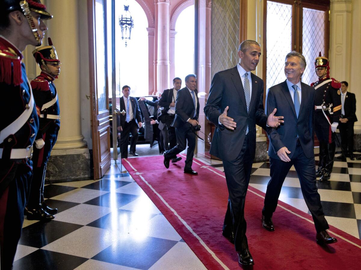 President Obama walks with Argentinian President Mauricio Macri at the Casa Rosada presidential palace in Buenos Aires on Wednesday.