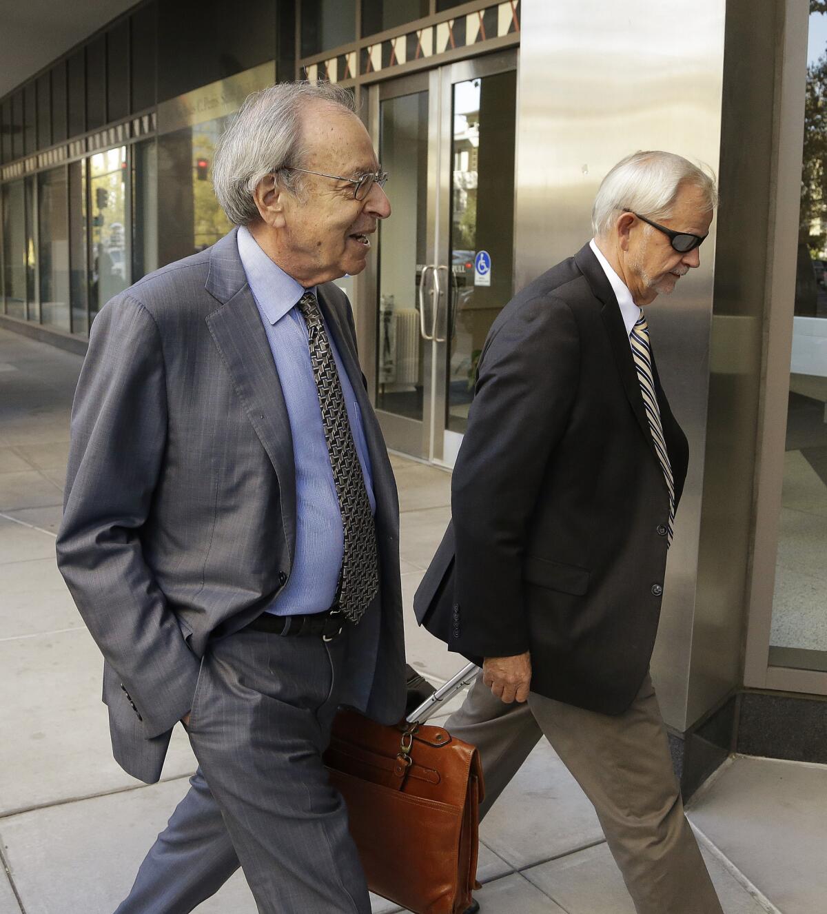 Federal mediator George Cohen, left, arriving for Bay Area Rapid Transit negotiations.