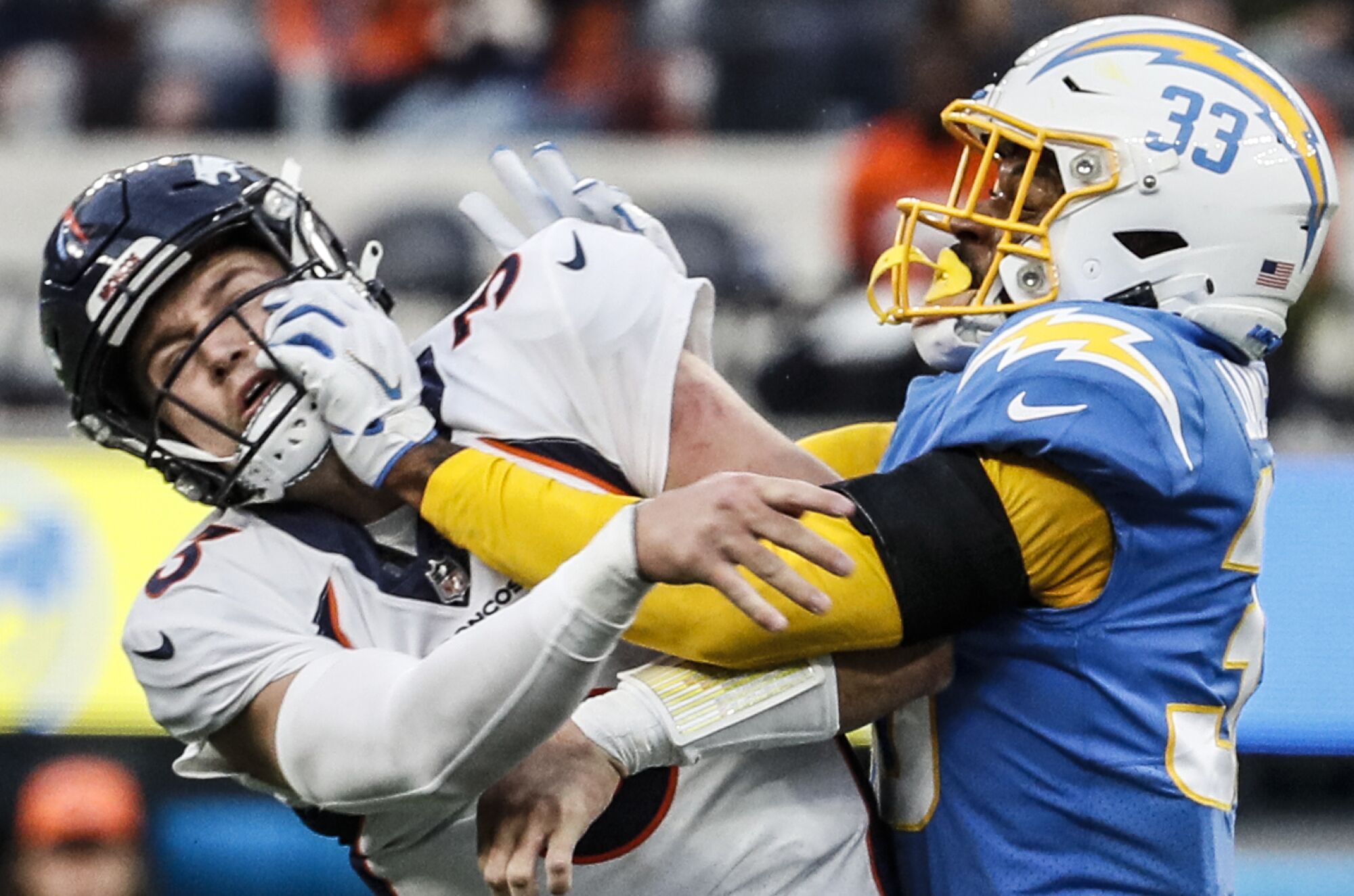 Chargers free safety Derwin James is penalized for roughing the passer as he hits Denver Broncos quarterback Drew Lock.