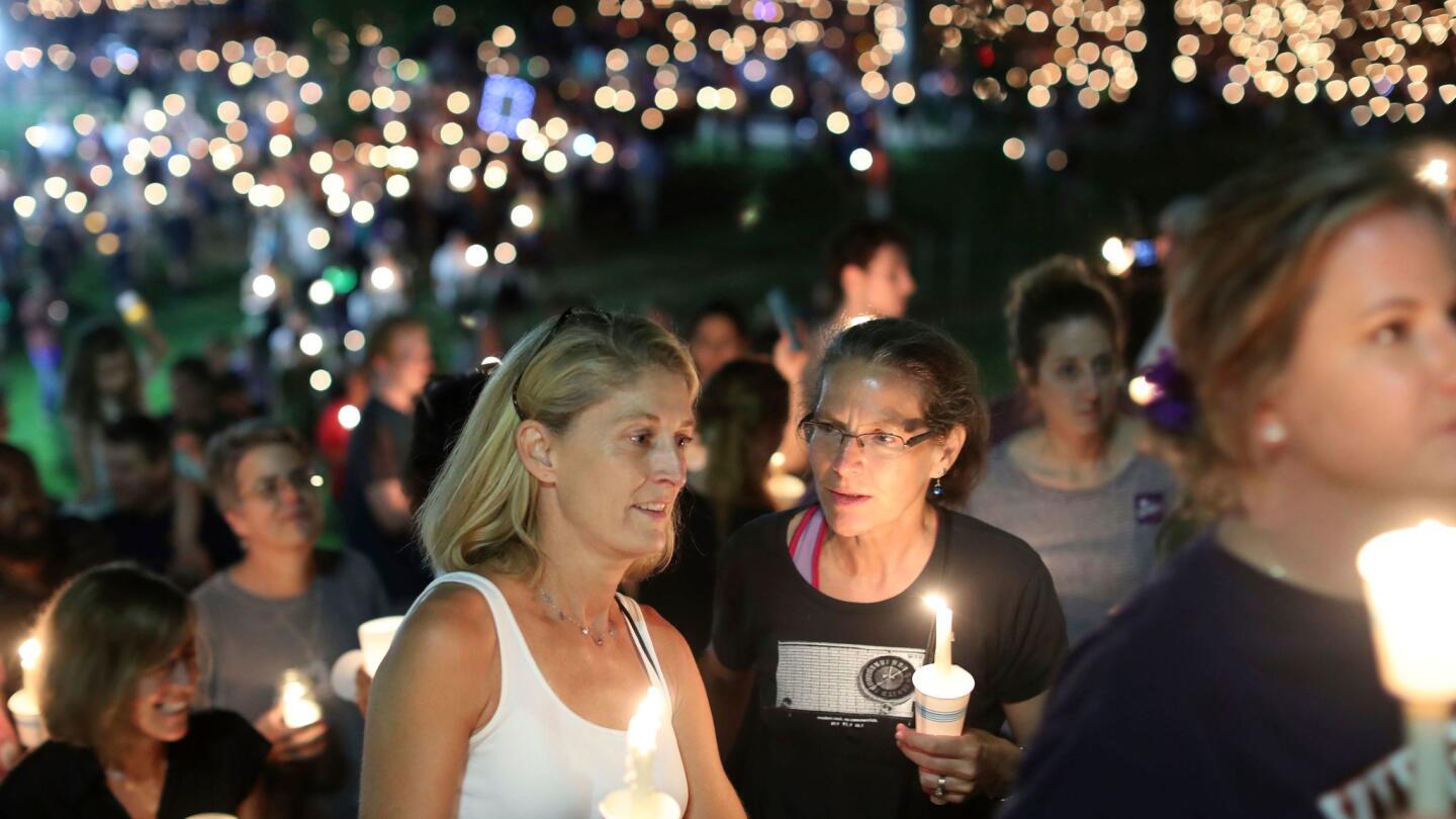 People participate in a candlelight vigil at the University of Virginia on Wednesday.