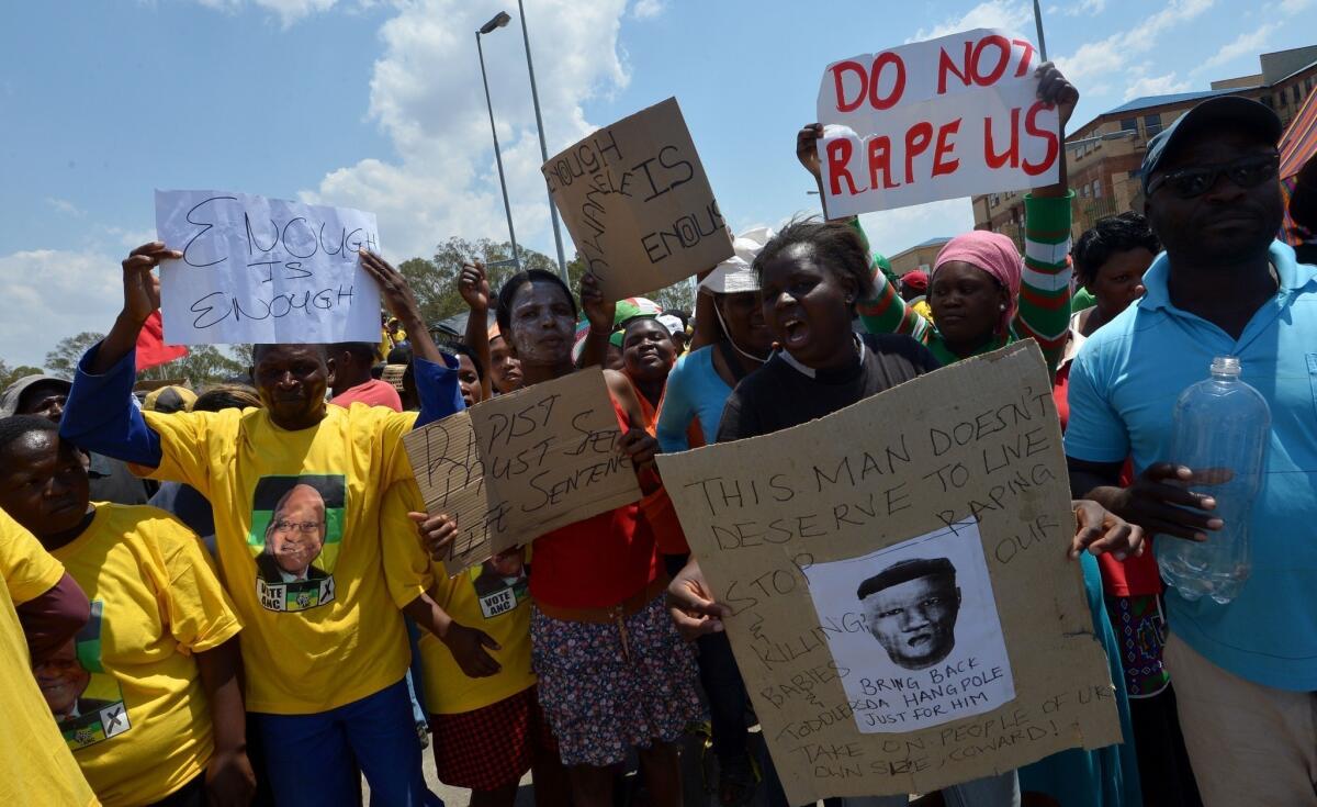 On Oct. 18, South African protesters rally in Diepsloot, north of Johannesburg, after five people were arrested in connection with the alleged rape and murder of two toddlers in a shantytown.