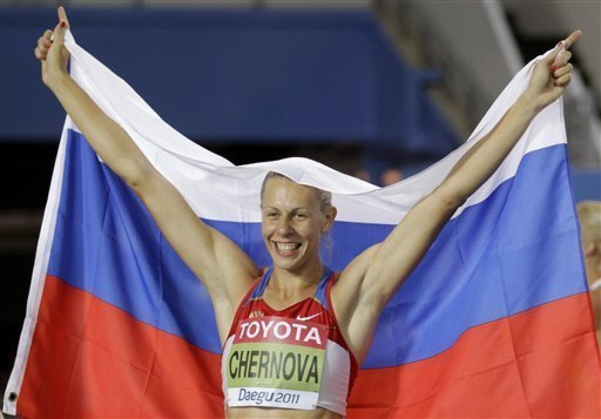 Russia's Tatyana Chernova celebrates after winning gold in the Heptathlon following the 800m at the World Athletics Championships in Daegu, South Korea, Tuesday, Aug. 30, 2011. (AP Photo/Matt Dunham)