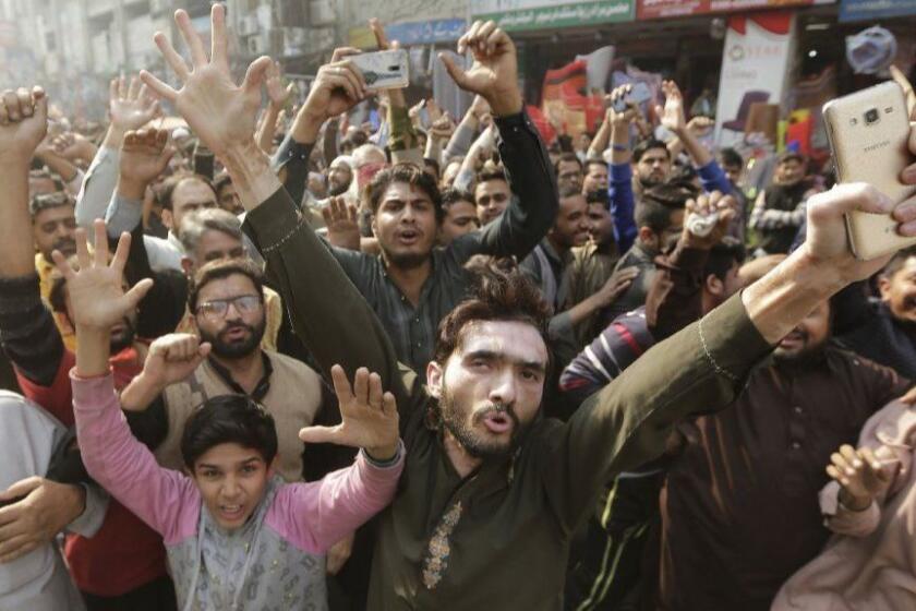 Mandatory Credit: Photo by RAHAT DAR/EPA-EFE/REX/Shutterstock (9239983f) Supporters of religous group 'Tehrik Labayk Ya Rasool Allah' shout slogans to protest the crackdown by Police on their group's supporters in Islamabad, in Lahore, Pakistan, 25 November 2017. Pakistani police on 25 November, cracked down in Islamabad on an anti-blasphemy sit-in by a hardline Islamist group that has been blocking one of the country's key highways for around two weeks demanding the resignation of the country's justice minister Zahid Hamid. The protests had erupted after the Pakistani Parliament approved an amendment to the electoral law on Oct. 2, removing an oath public servants had to take before assuming office, reiterating their belief in Prophet Mohammed as the last prophet of Islam. Following massive protests by hardline Islamists, three days later the parliament reinstated the article and Zahid Hamid, the justice minister had issued a video to pacify the protesters. Islamist protestors in Karachi after security forces launched crackdown to disper religious protesters in Islamabad, Lahore, Pakistan - 25 Nov 2017 ** Usable by LA, CT and MoD ONLY **